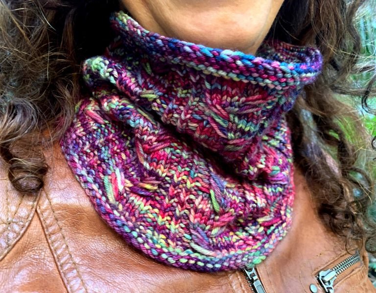 A close up of a cowl made with the Next Chapter Knitting pattern